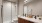 a bathroom with a shower unit and toilet