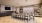 private dining room with shelves and wall mounted tv