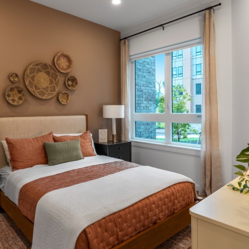 bedroom with bed endtable and lamp