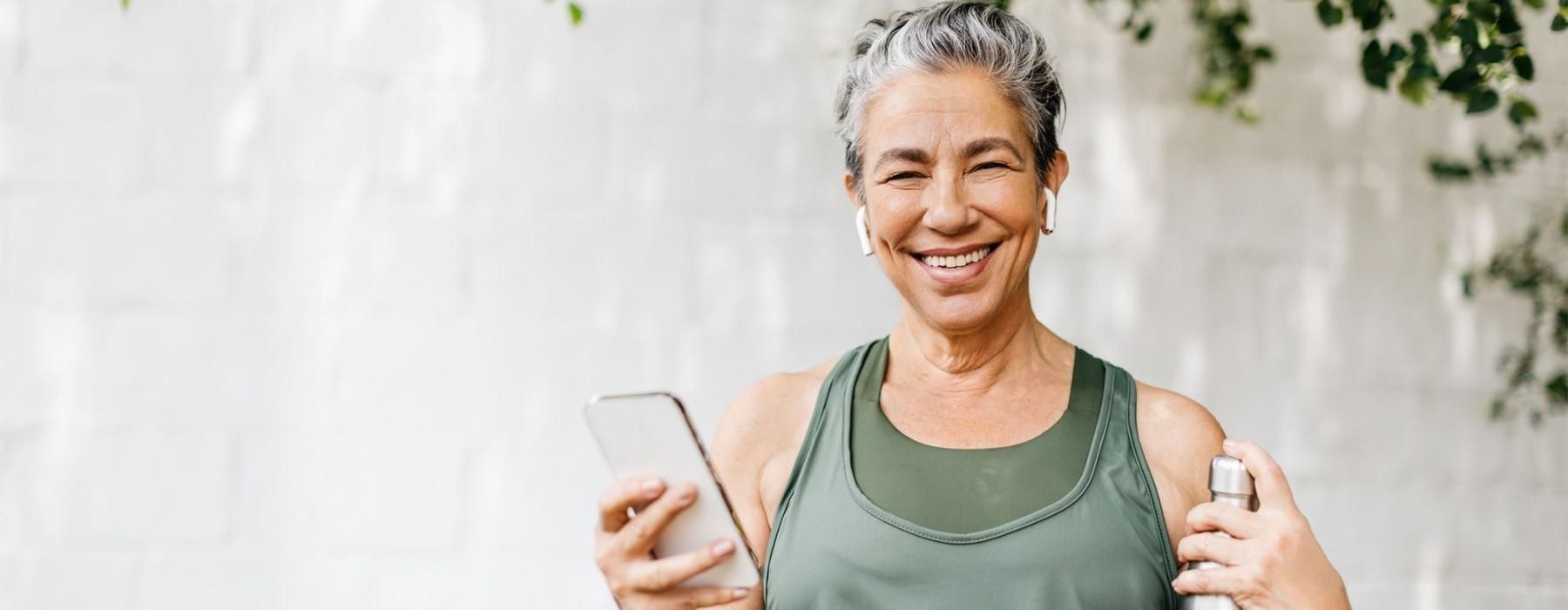 a woman holding a phone