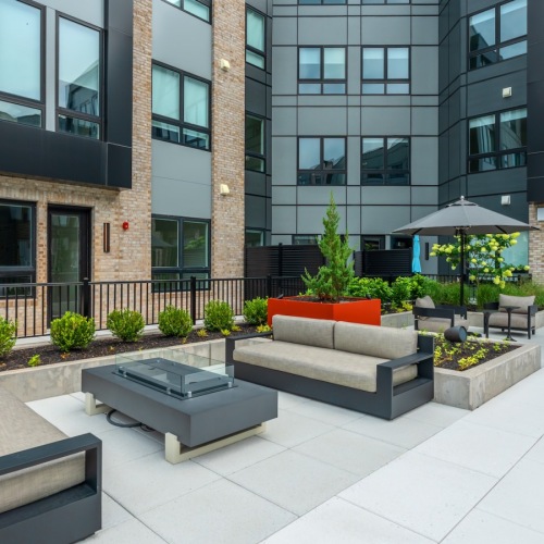 courtyard with chairs and a firepit
